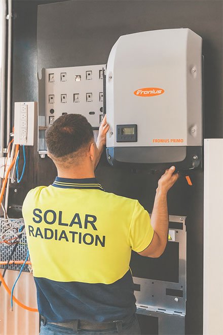 A technical person installs a Fronius inverter.