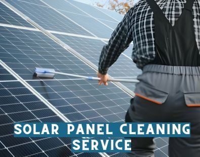 A Man cleaning solar panels with a brush